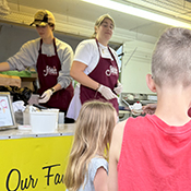 Two children are waiting to be served Adele's frozen custard workers in Excelsior, Minnesota 